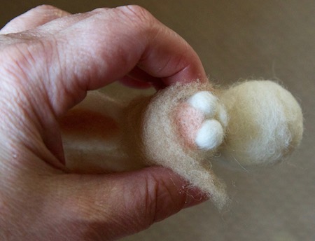 Covering the bunny with woollen fur