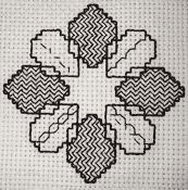Photograph showing the stages of working the second blackwork pattern Photograph showing the stages of working the second blackwork pattern