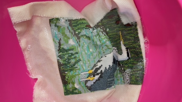 Continue rinsing until the suds disappear