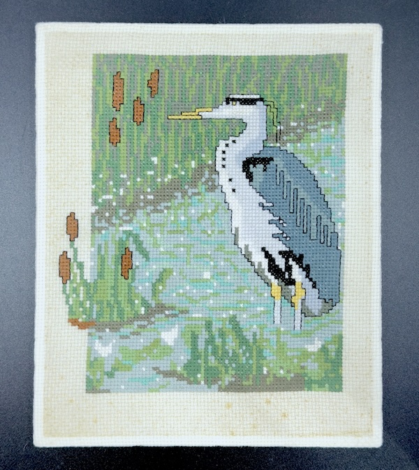 Discoloured and stained cross stitch