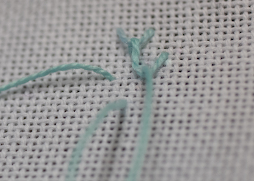 Step 3 in working single feather stitch Step 3 in working single feather stitch