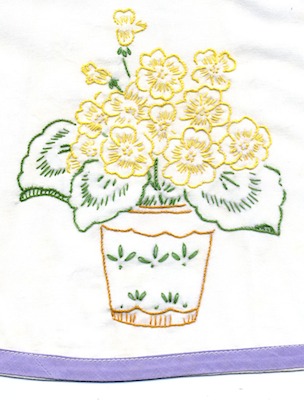 A detail of an embroidered plant on a pillowcase A detail of an embroidered plant on a pillowcase