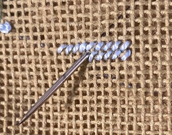 Tent stitch on canvas shown from the front of the work Tent stitch on canvas shown from the front of the work