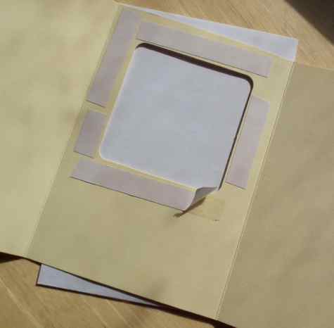Placing the double sided tape inside the aperture card Placing the double sided tape inside the aperture card
