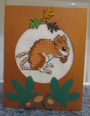 Lorraine stitched my mouse and mounted it into a card with a circular aperture Lorraine stitched my mouse and mounted it into a card with a circular aperture