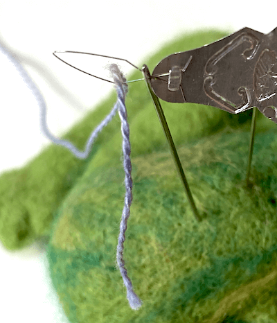 passing thread through wire loop