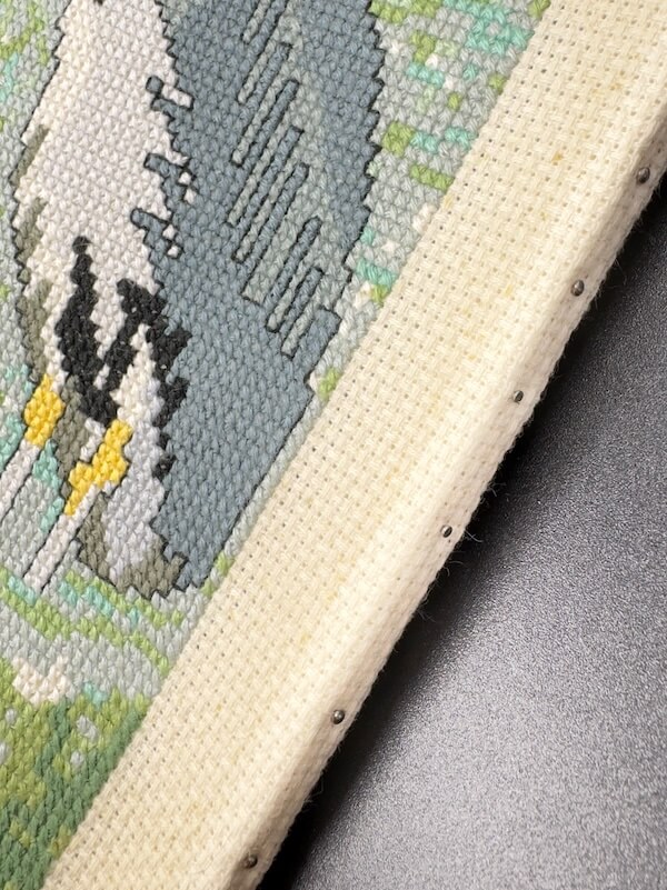 showing the dirt from years of carring cross stitch around