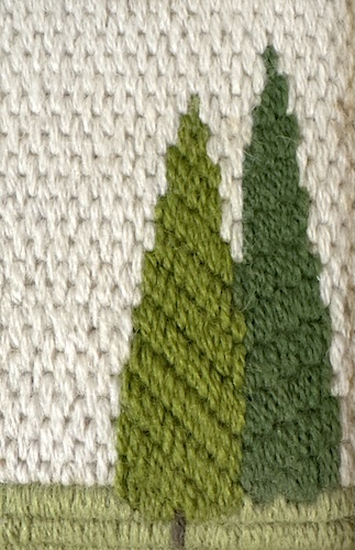 Two upright gobelin stitch tree designs showing different dropping techniques