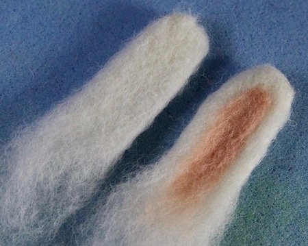 Adding pink wool to the inside of the ears