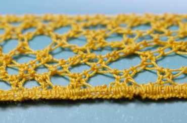 Buttonhole stitches worked over the wire and cordonnet