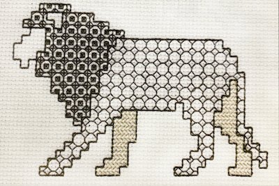 An advanced blackwork lion design with intricate fill patterns