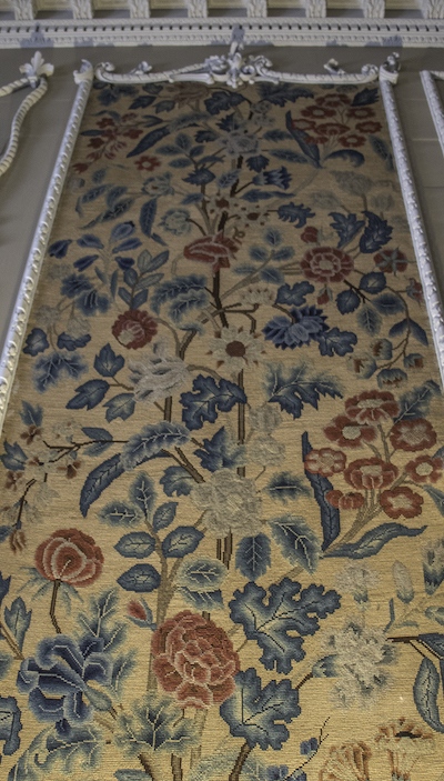 Close up of a Lady Julia Calverley needlepoint panel worked in tent stitch in wool and silk