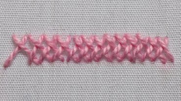 Closed herringbone stitch from the front showing solid braided line