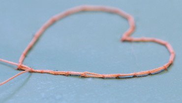 The completed cordonet outline for the needle lace heart