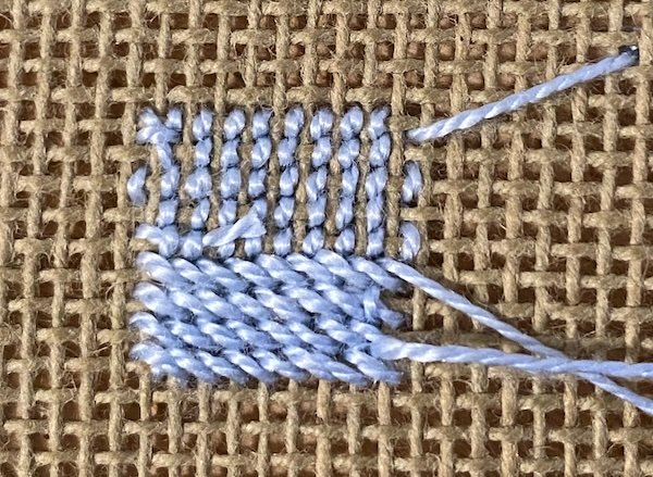 The back of continental vs half cross stitch showing more thread