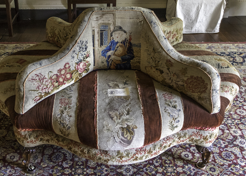 Needlepoint covered Conversation Seat for four people at Wallington