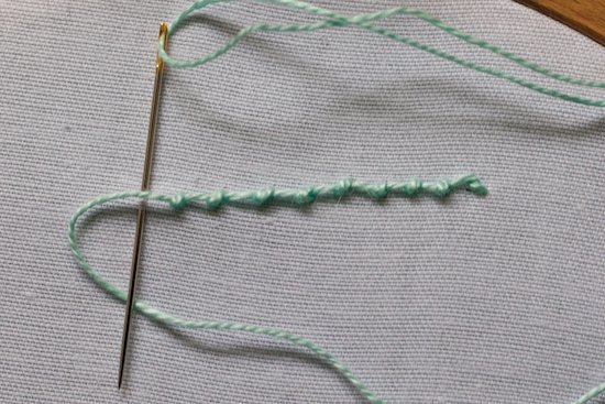 Coral knot stitch being worked