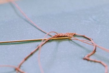 Completing the first row of corded single Brussels stitch