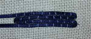 Couching stitches arranged in a brickwork formation