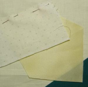 Adding the first fabric piece to the foundation square