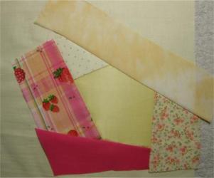 The quilt block so far with five patches