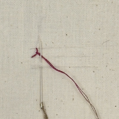 Cretan stitch step 2 — the little flip to the bottom line