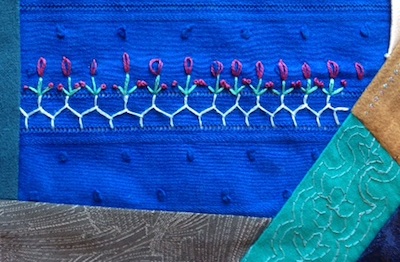 Cretan stitch vine with lazy daisy flowers and French knot buds