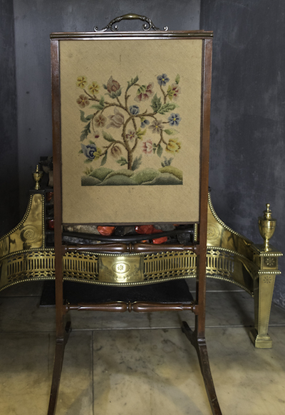 Fire screen worked in tent stitch in a crewel embroidery style at Wallington