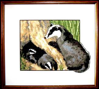 Badger family counted cross stitch design breaking out beyond its border