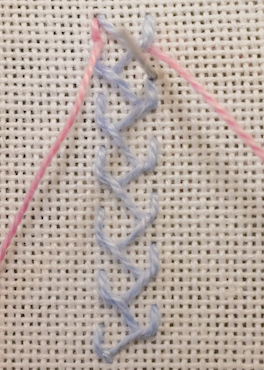 Crossed feather stitch first layer