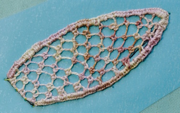 The sepal worked in double Brussels stitch
