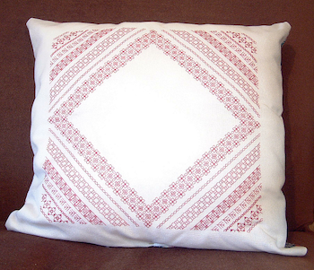 Blackwork Diagonal Sampler with rows of border patterns in pink and white
