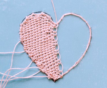 The first row of double Brussels stitch on the needle lace heart