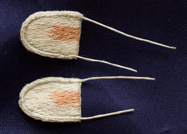 Bunny ears wired with buttonhole stitch edging and cut out from the fabric