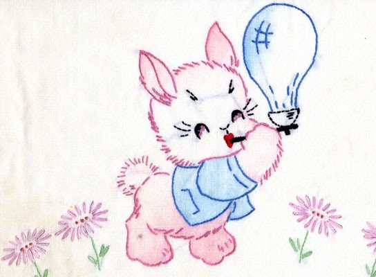 A crib pillow embroidered with just outlines