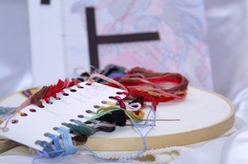 Embroidery floss attached to a Loran project card