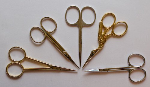 Several pairs of embroidery scissors