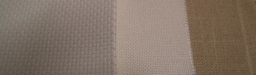 Photo showing the difference between the appearance of Aida and linen fabric