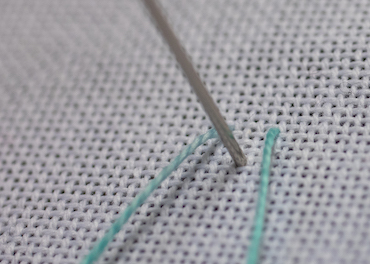 Step 1 in working single feather stitch