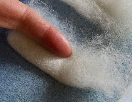 Rolling and stabbing the felted bunny ears