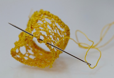 Gathering the base of the trumpet with running stitch