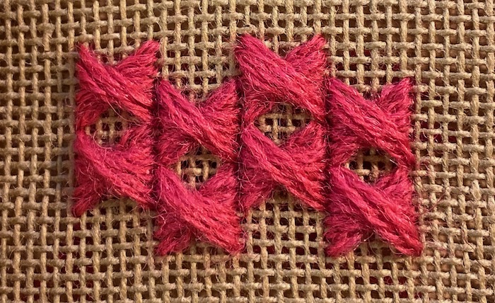 Two rows of staggered half Rhodes stitch showing diamond-shaped gaps