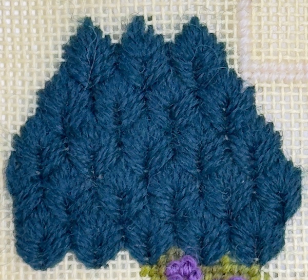 Leaf stitch bush worked in needlepoint