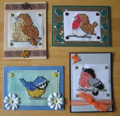 4 cross stitched cards on display, all Little Ones designs