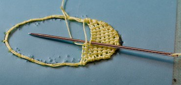 A petal being filled with corded single Brussels stitch