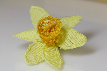 The completed needlelace daffodil flower without stem