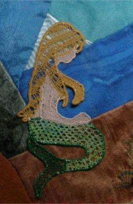 A coloured mermaid worked in needlelace by the author