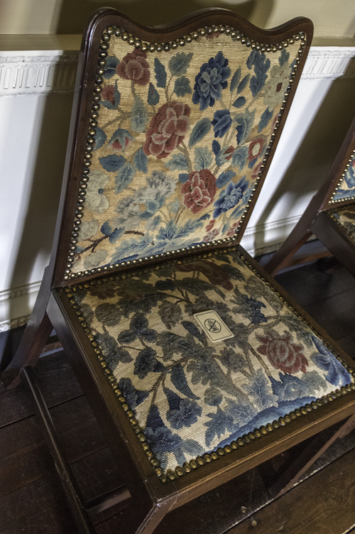 Needlepoint covered chair in the Needlework Room at Wallington