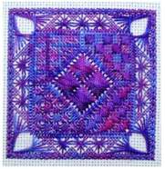 My Hope needlepoint square in purple over-dyed threads with shiny rayon Rhodes heart stitches drawing the eye to the centre