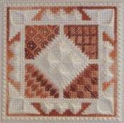 Erica's Hope needlepoint square in cream and brown monochromatic palette with multi-coloured thread accents highlighting the corner stitches